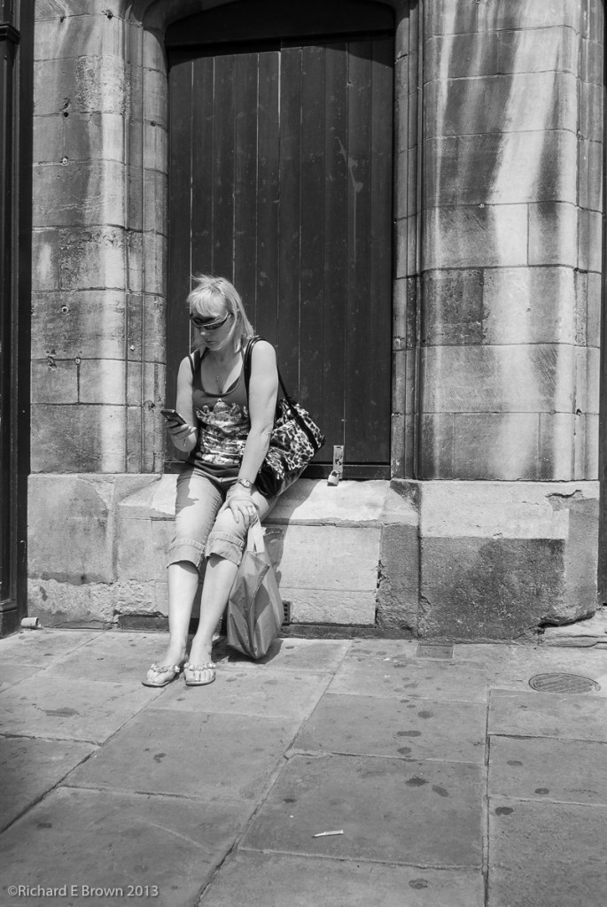 Woman on the Phone - Street shooting with Nikon V1- 10mm f.2.8, 28mm Field of view