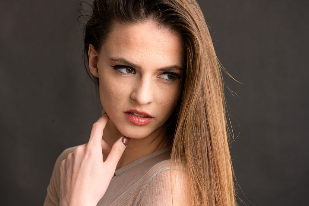 Close up portrait of Kimberly looking off camera to the side