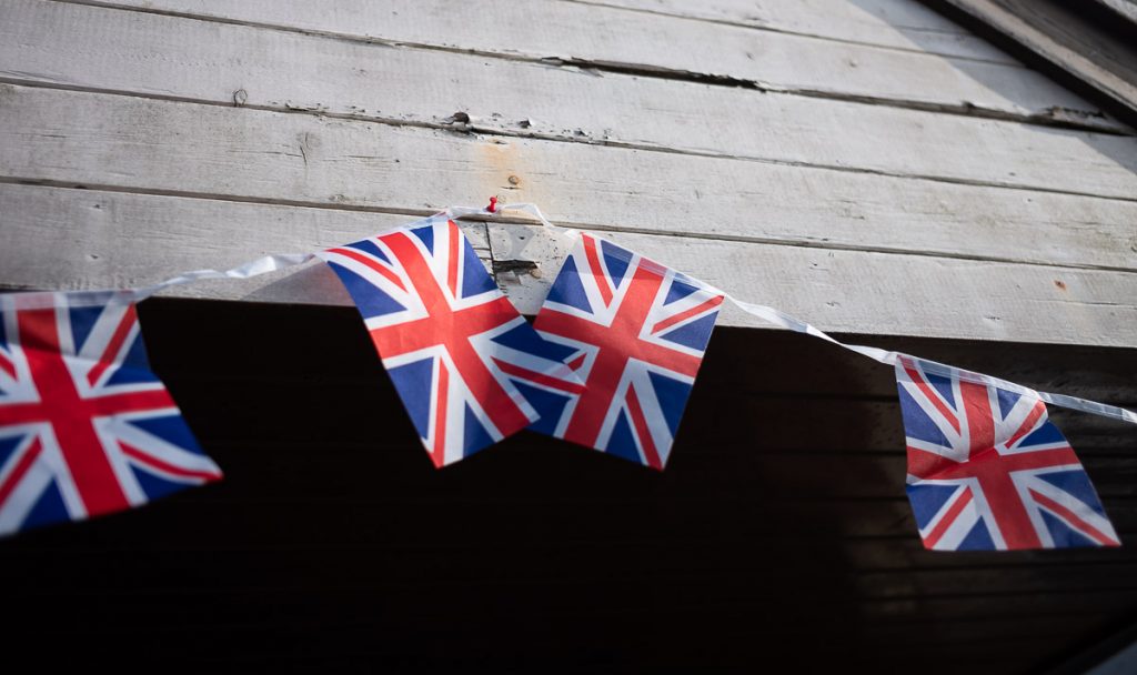 Line of Union flags on a village hall