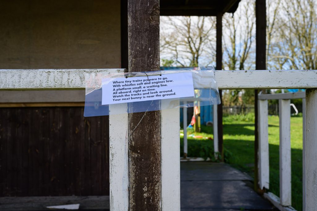 Where tiny trains prepare to go   With whistles soft and engines low.  A platform small, a waiting line,  All aboard, right on time, watch the tracks and look around, your next bunny is near the ground.