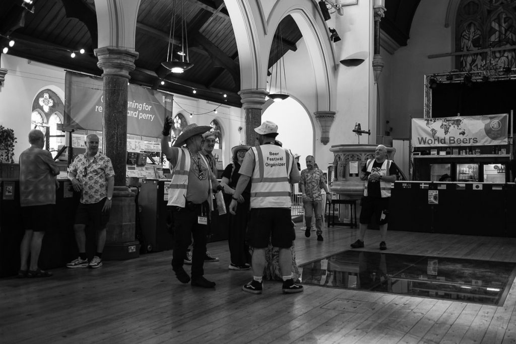 The central indoor area. Some of the organisers are taking selfies.
