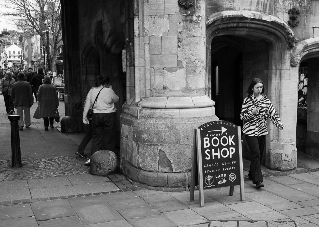 Stonebow in Lincoln with people walking through.