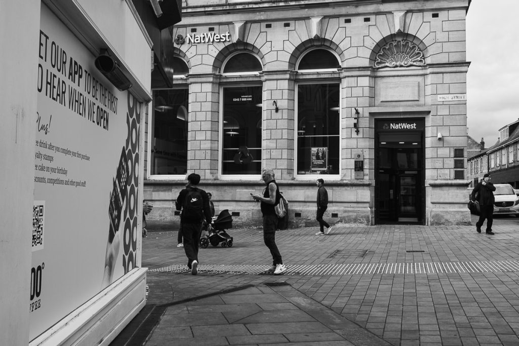 People hurrying along Lincoln High Street in there lunch break
