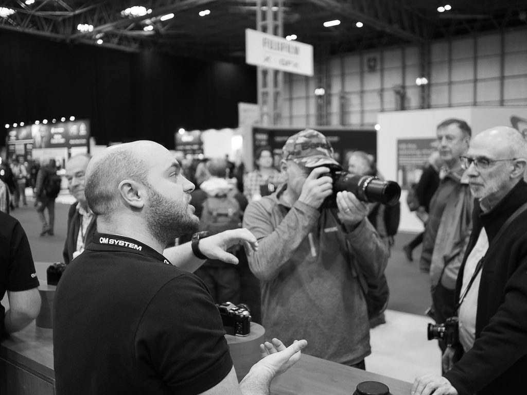 Olympus now OM stand at the NEC photography show.  People at the stand trying out the new OM 3.