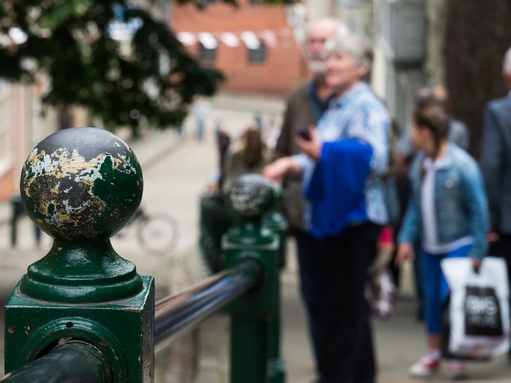 Steep hill. The old victorian hand rail in close up.